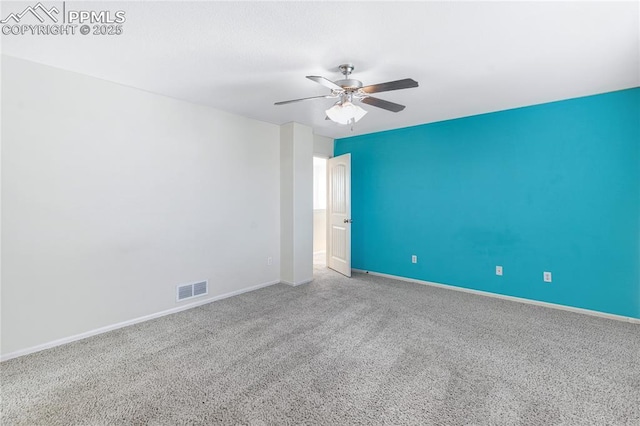 carpeted empty room featuring ceiling fan