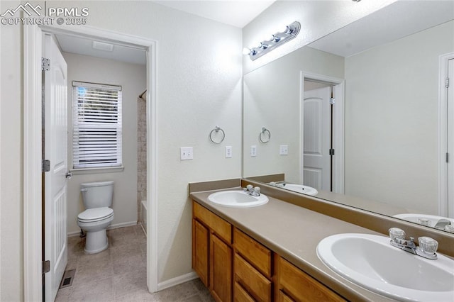 full bathroom featuring vanity, toilet, and  shower combination