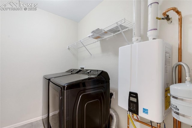 washroom featuring washer and dryer and water heater