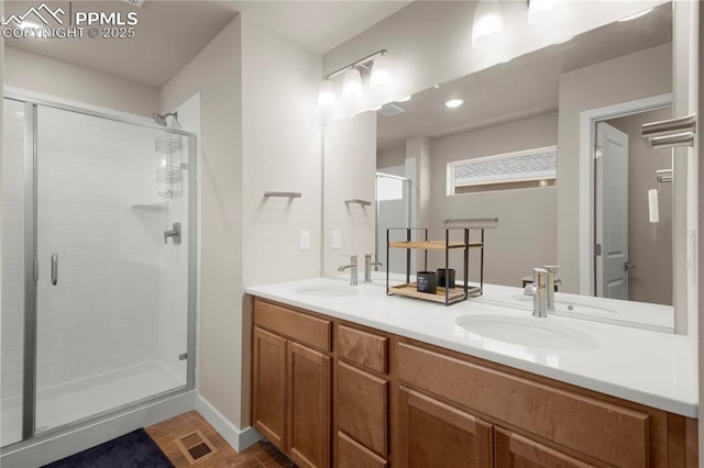 bathroom featuring vanity and an enclosed shower