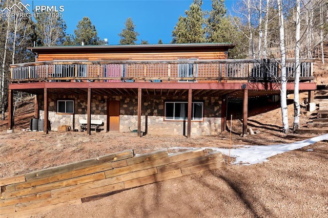 back of house with a wooden deck