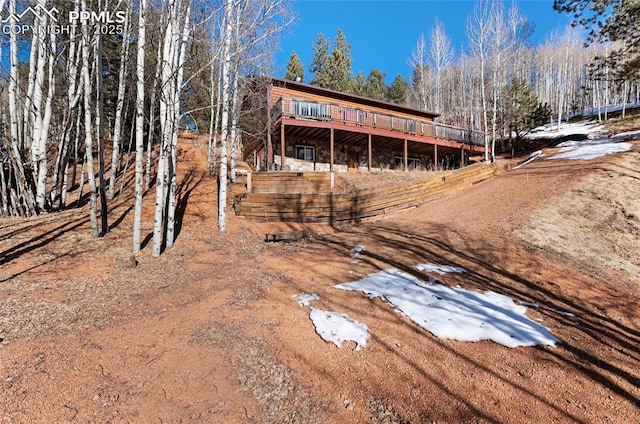 exterior space featuring a wooden deck