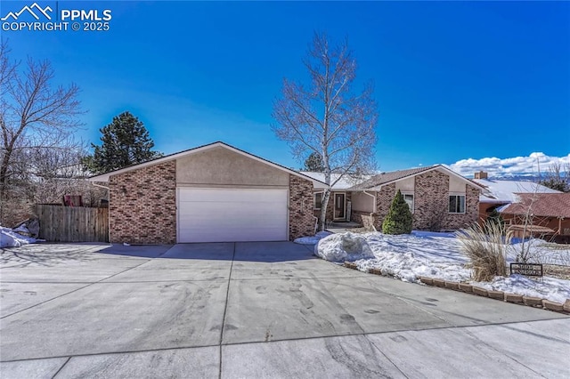 single story home featuring a garage