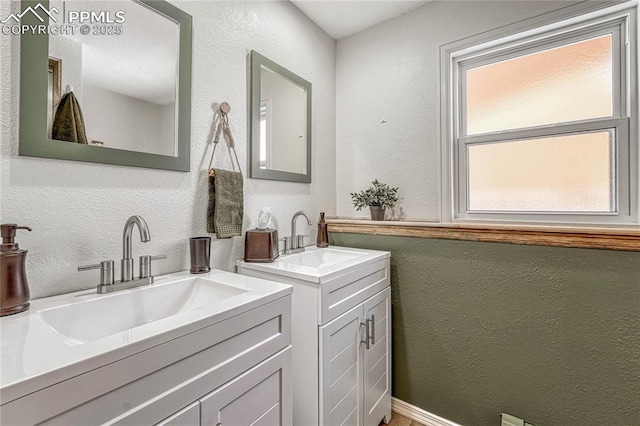 bathroom featuring vanity and plenty of natural light