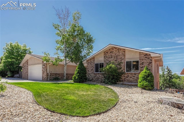 ranch-style home featuring a garage and a front lawn