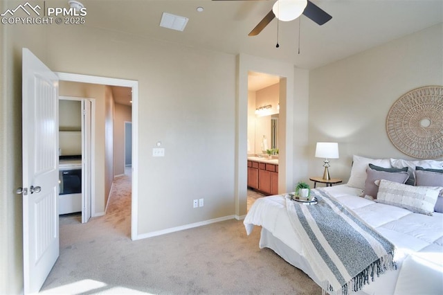 carpeted bedroom with connected bathroom and ceiling fan