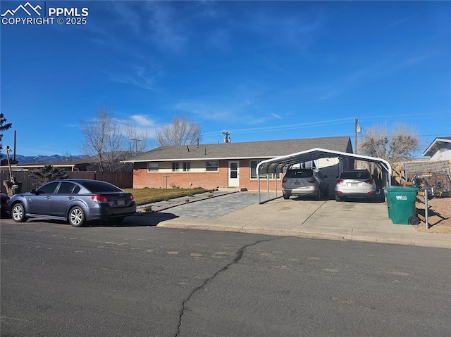 view of front of home with a carport