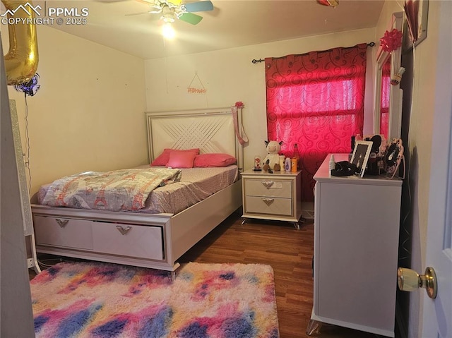 bedroom featuring dark wood-type flooring and ceiling fan