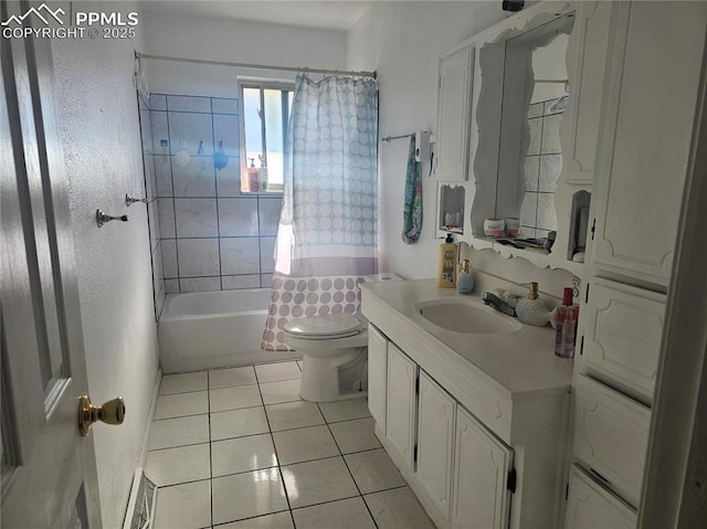 full bathroom featuring shower / tub combo with curtain, tile patterned floors, toilet, and vanity