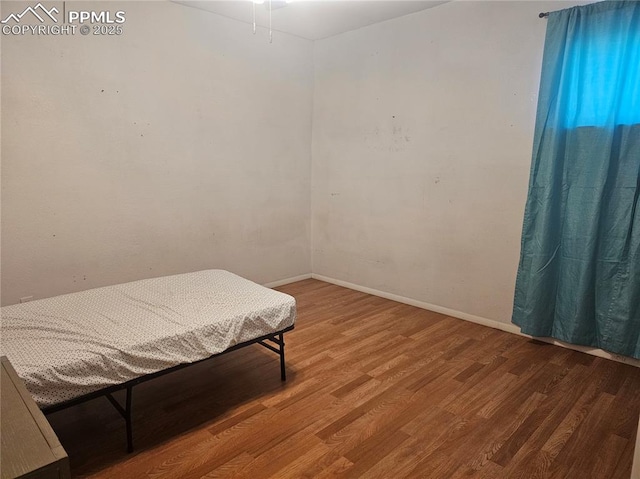 bedroom featuring wood-type flooring