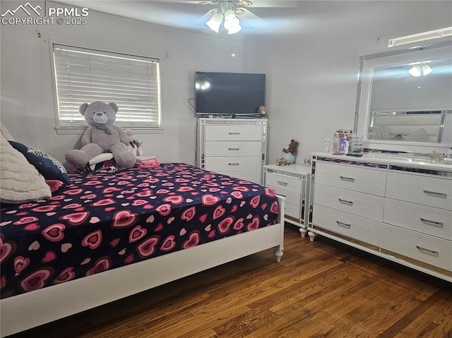 bedroom featuring dark hardwood / wood-style floors and ceiling fan