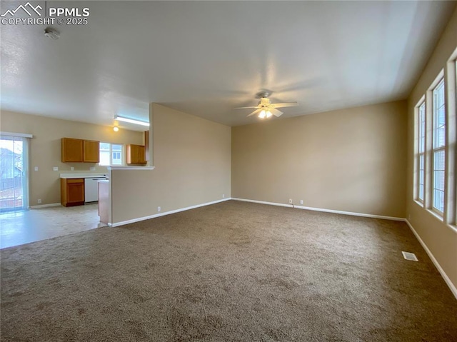 unfurnished living room featuring ceiling fan and light colored carpet