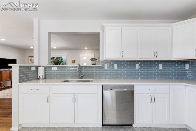 kitchen with white cabinetry, stainless steel dishwasher, and sink