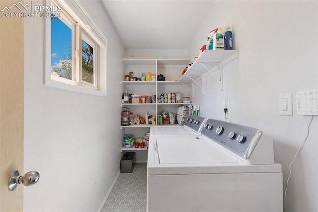 clothes washing area featuring washer and clothes dryer