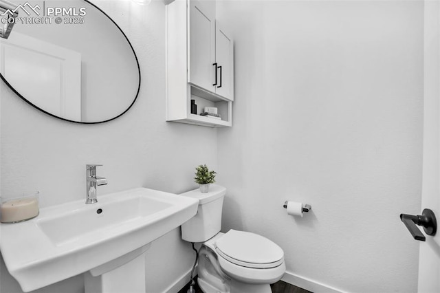 bathroom with sink and toilet