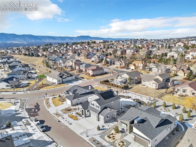 birds eye view of property with a mountain view