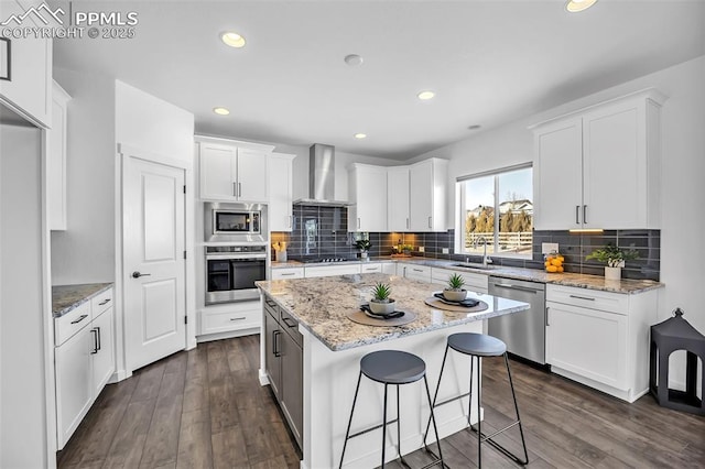 kitchen featuring white cabinetry and appliances with stainless steel finishes