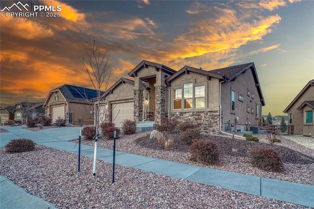 craftsman house with cooling unit and a garage