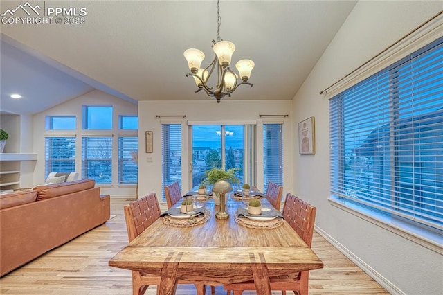 dining space featuring a chandelier and light wood-type flooring