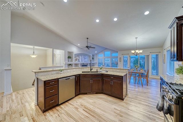 kitchen with sink, pendant lighting, light hardwood / wood-style floors, ceiling fan with notable chandelier, and appliances with stainless steel finishes