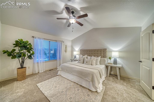 bedroom featuring ceiling fan, light carpet, and vaulted ceiling