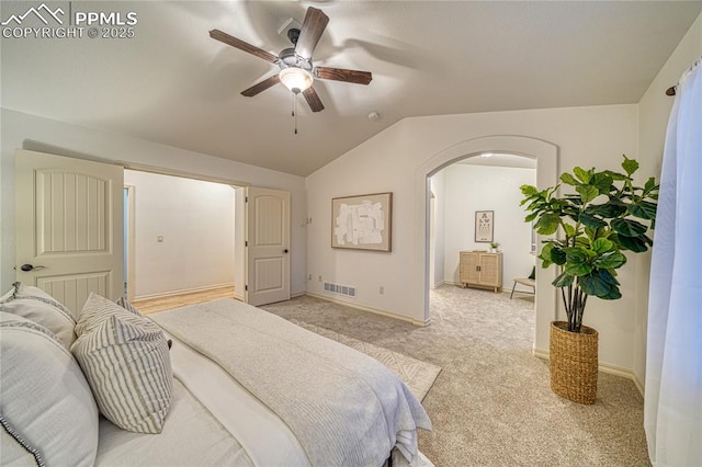 carpeted bedroom featuring ceiling fan and lofted ceiling