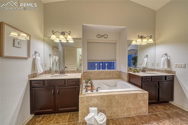 bathroom with a relaxing tiled tub and vanity