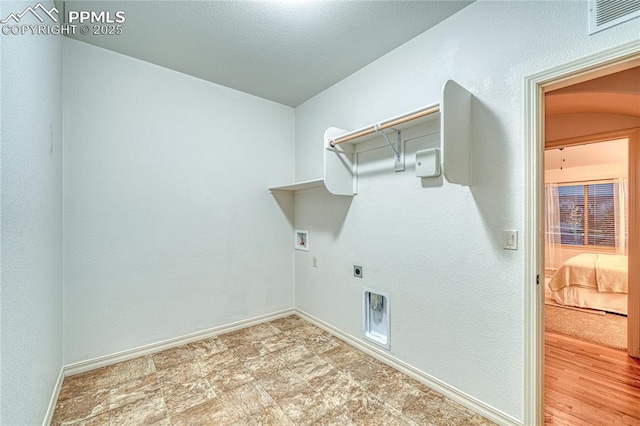 laundry room with hookup for an electric dryer and hookup for a washing machine