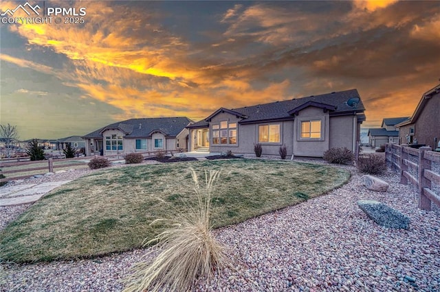 view of front of property with a yard