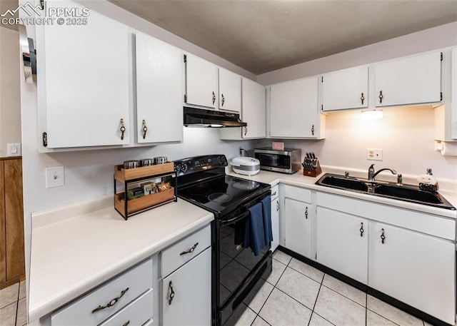 kitchen featuring black electric range oven, white cabinetry, sink, and light tile patterned floors