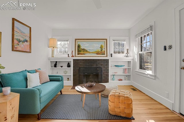 living room featuring a fireplace and hardwood / wood-style flooring