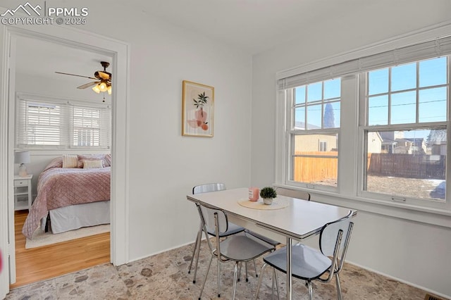 dining space featuring ceiling fan