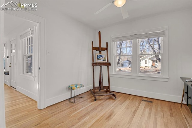 interior space featuring light wood-type flooring and ceiling fan