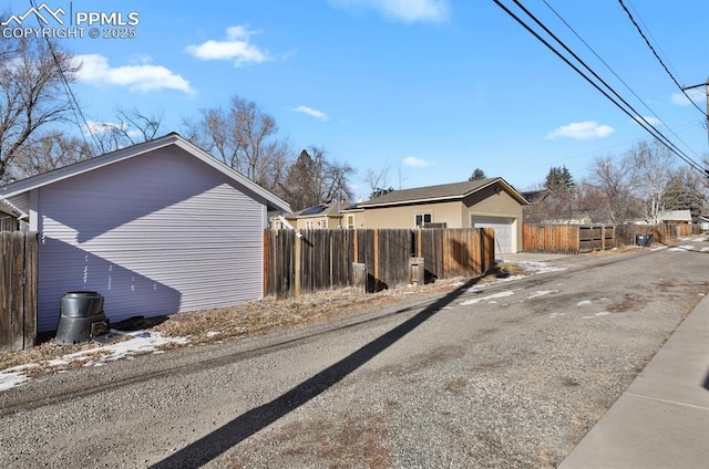 view of side of property featuring a garage