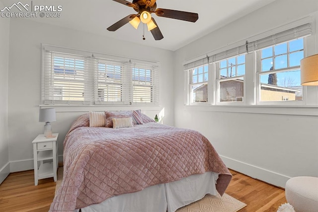 bedroom featuring ceiling fan and light hardwood / wood-style floors