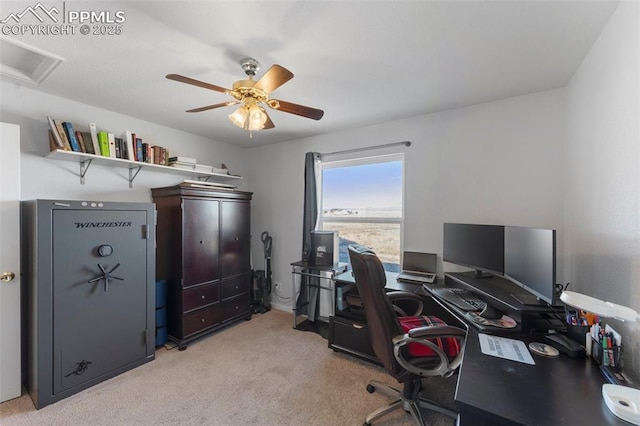 office space featuring ceiling fan and light colored carpet