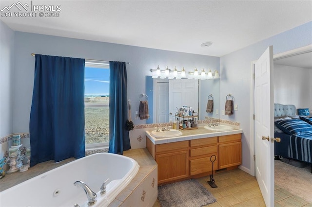 bathroom featuring tile patterned flooring, vanity, and a relaxing tiled tub