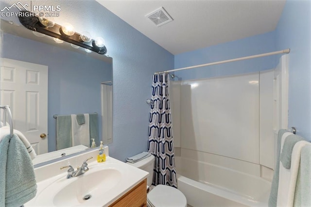 full bathroom featuring shower / bath combination with curtain, vanity, and toilet