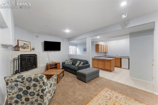 living room featuring a fireplace and light colored carpet