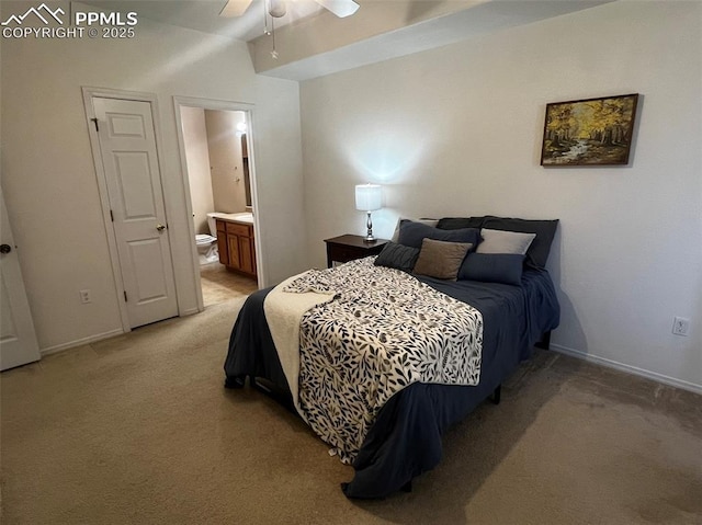 bedroom with connected bathroom, ceiling fan, and light carpet