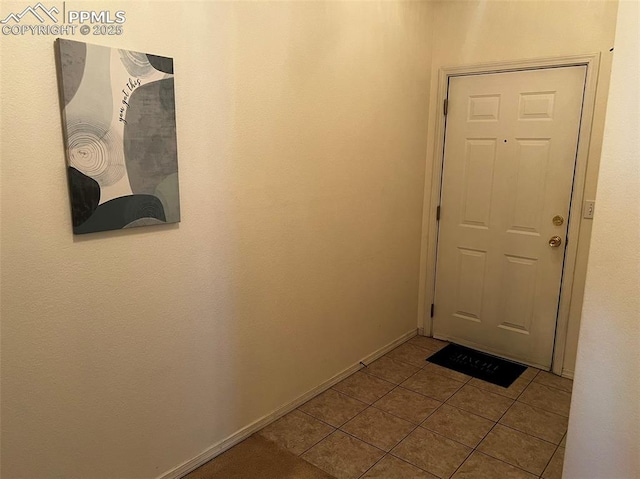 doorway featuring light tile patterned floors