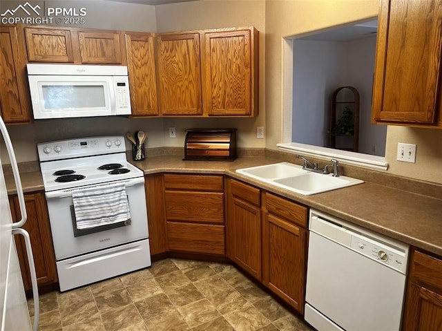 kitchen with white appliances and sink