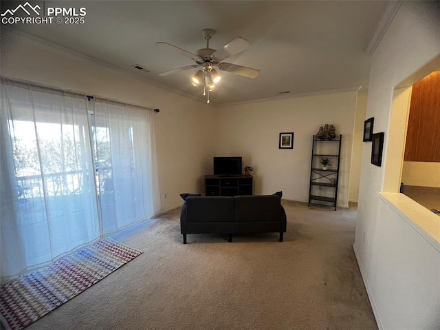 carpeted living room with ceiling fan and crown molding