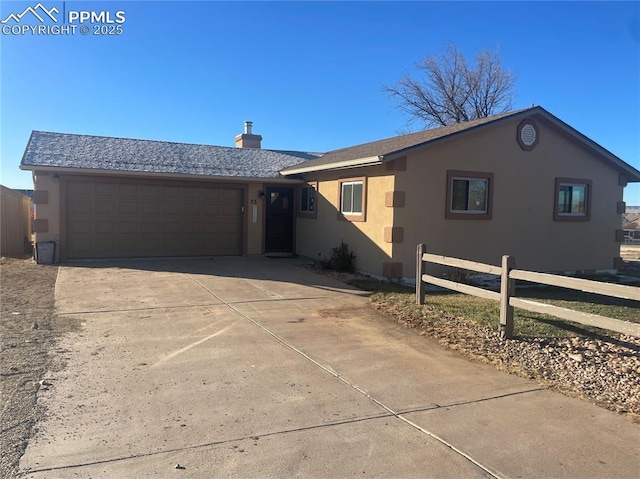 ranch-style house featuring a garage