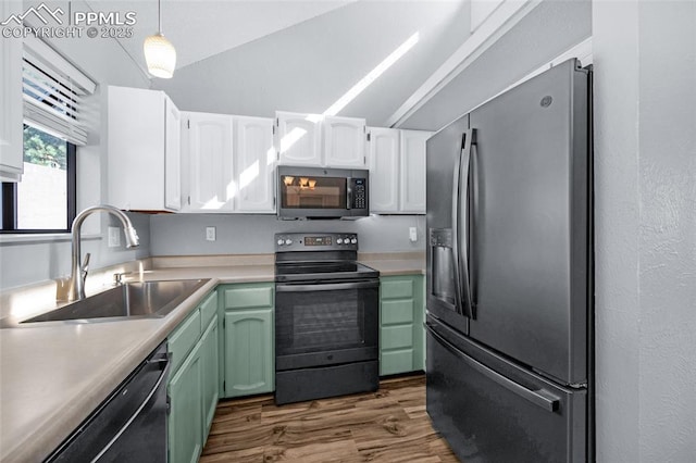 kitchen with sink, hanging light fixtures, green cabinets, white cabinets, and black appliances