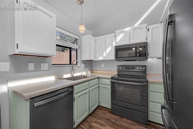 kitchen with white cabinetry, sink, decorative light fixtures, and appliances with stainless steel finishes