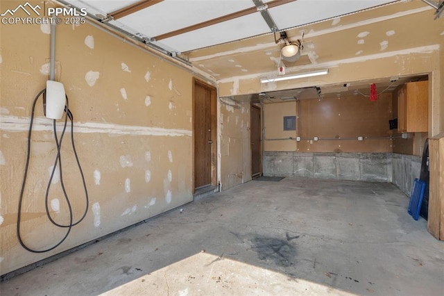 garage featuring a garage door opener and electric panel