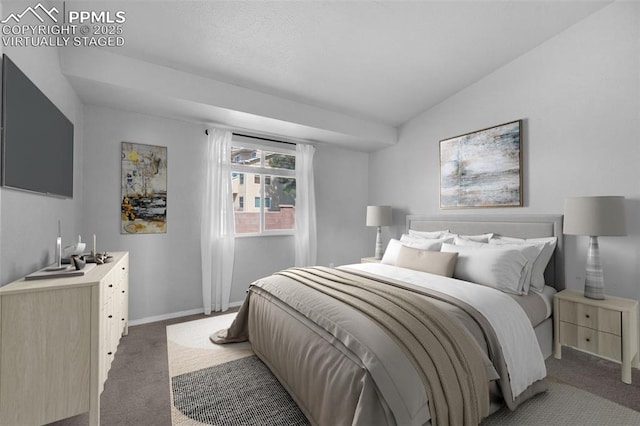 bedroom featuring dark colored carpet and lofted ceiling