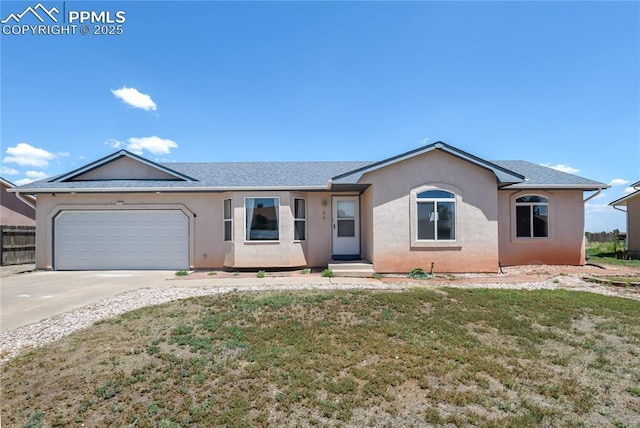 single story home with a front yard and a garage