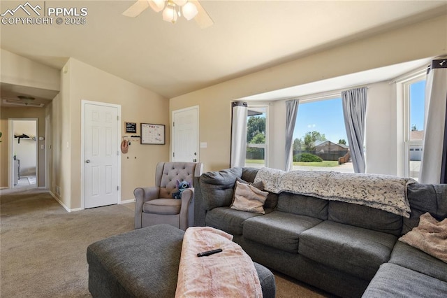 living room featuring ceiling fan, carpet, and lofted ceiling